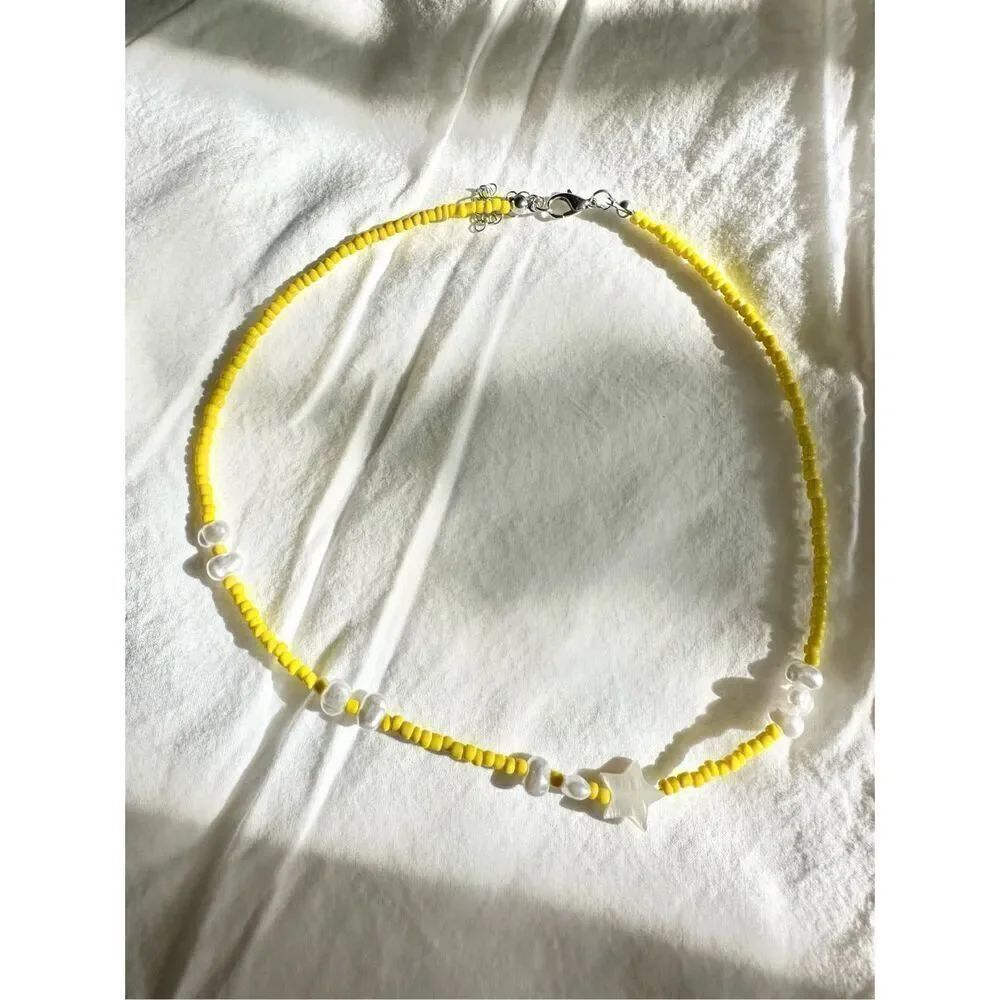 Yellow beaded star sea shell and pearl beach necklace